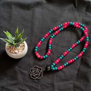 Hand assembled beaded necklace brass rose